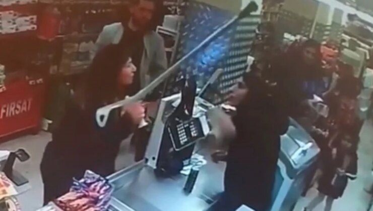 İkinci kasanın açılmamasına öfkelenen kadın, kasiyere koltuk değneğiyle saldırdı